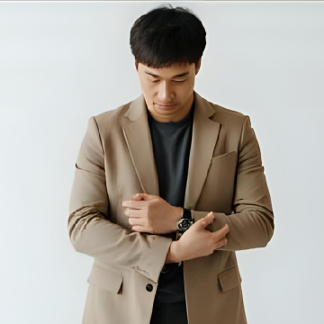 a man thinking of a stylish watch to fit his outfit
